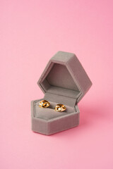 Small jewelry box on pink studio background