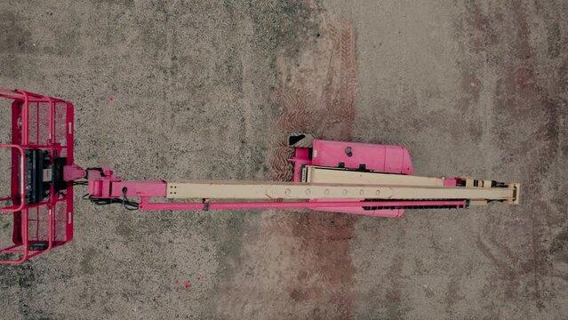 Telescopic Boom Lift on a construction dirty parking lot. scissor lift