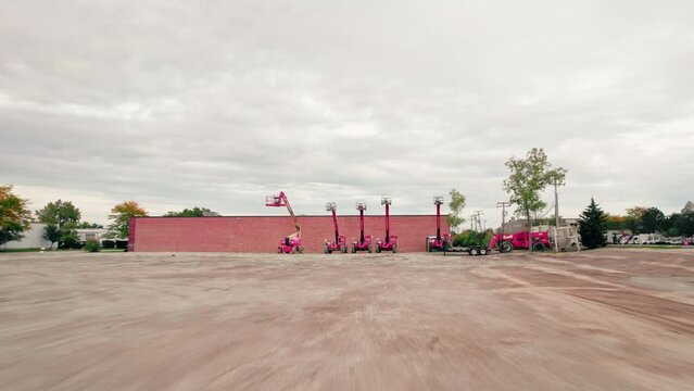 low flying aerial towards heavy duty construction equipment. Telescopic Boom Lift , telescopic fork lift, telehandlers.