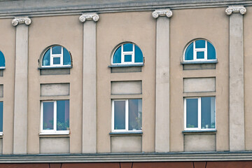 Fragment of the facade of a historic building on an autumn day