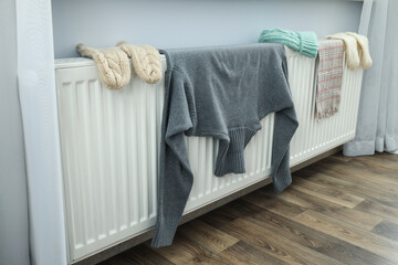 Clothes are dried on the radiator after washing