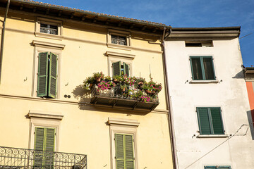 Fototapeta na wymiar Beautiful italian facade of a house, sunshine lights.