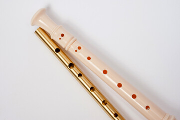 Irish whistle and block flute are longitudinal flutes with a whistle device and playing holes.