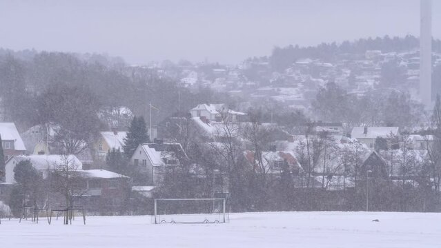 Football Pitch and Villa area with Snowfall, Residential Neighborhood at Winter