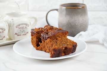 Pieces of fresh brownie on white plate. Delicious chocolate pie