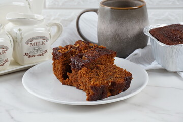 Pieces of fresh brownie on white plate. Delicious chocolate pie
