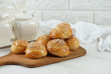 Non sweet bakery. Baked round buns with Sesame seed
