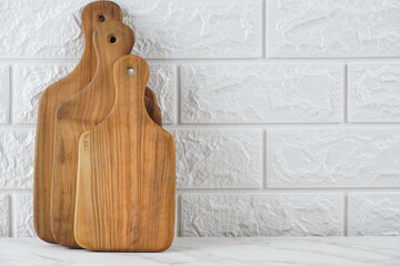 Set of different cutting wooden boards on white background.