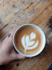 cup of coffee on wooden table