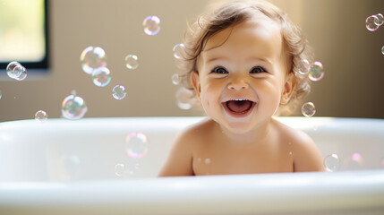 Happy cute baby in a bath with foam and soap bubbles , healthcare for young children. - obrazy, fototapety, plakaty