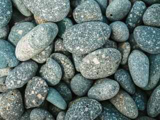 Pebbles stacked in the seaside. background.	