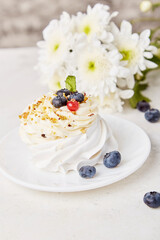 Tasty Pavlova Dessert with blueberry. Autumn aesthetics vibes background. Hygge home. Cozy home