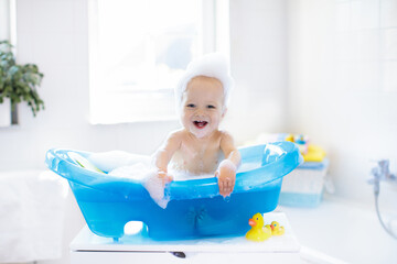 Little baby taking a bath