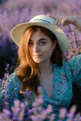 A young woman with a hat in a lavender field