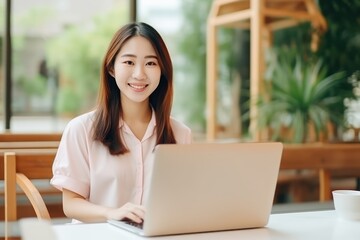 Fototapeta na wymiar Asian student learning in front of laptop 
