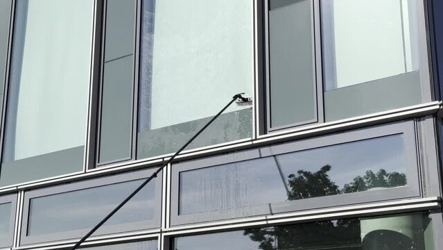 Exterior cleaning or window cleaning of a facade with a Water-fed pole