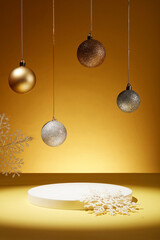 Over the yellow background, several blinking baubles are hanging on. Snow shaped ornaments...