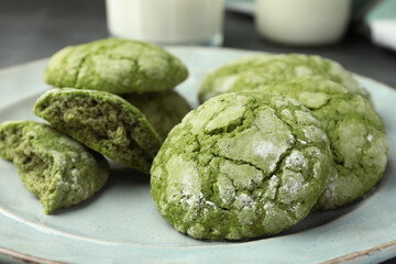 Tasty matcha cookies on light plate, closeup