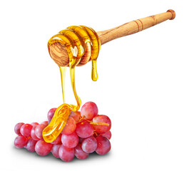 dripping honey on grapes isolated on white background