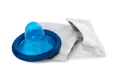 Unpacked condom and torn package on white background. Safe sex