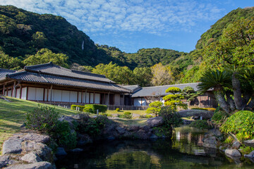 Scenery of Sengan-en, Traditional Japanese Garden in Kagoshima, a pond and the buildings