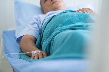 Patient lying on the bed and resting in hospital. - obrazy, fototapety, plakaty