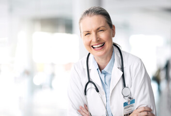 Stethoscope, senior laughing and woman doctor with healthcare, medical work and hospital job....