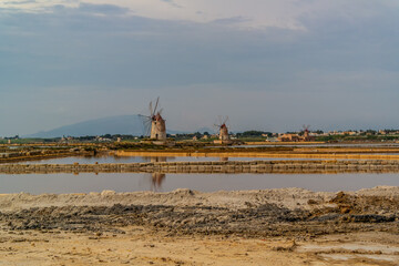 View over the salt pans of Marsala with its windmills, Sicily, Italy