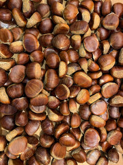 Grocery background with chestnuts scattered on the store counter