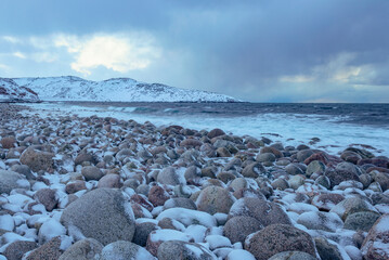 The beach of round stones. The coast of the Barents Sea. Teriberka, Russia