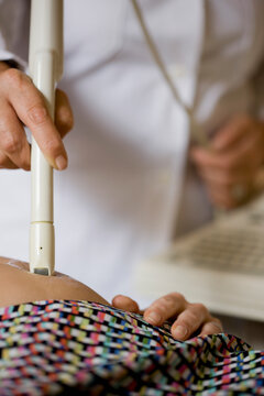 Close up of a doctor hand performing an ultrasound scan
