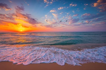 Fotobehang Bora Bora, Frans Polynesië Ocean sunrise over beach shore and waves. The sun is rising up over sea horizon