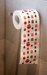 A roll of toilet paper adorned with charming Christmas drawings, instilling joy and festive Christmas spirit in every use