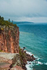 Palisade Head cliff on Lake Superior. Rocky shore with a blue and clear lake in the autumn