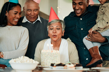 Happy birthday, candles or grandma in home for a family celebration, bond or growth together. Blow,...