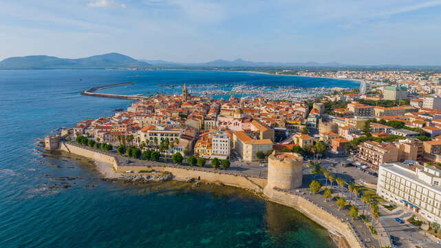 Aerial view of the old town of Alghero in Sardinia. Photo taken with a drone on a sunny day. Panoramic view of the old town and harbor of Alghero, Sardinia, Italy.