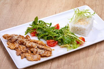 meat with salad and rice