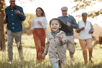 Park, running and girl with parents or grandparents on grass field for freedom, adventure or playing in summer. Family, men or women with fun or love in forest with sunshine for care or happiness