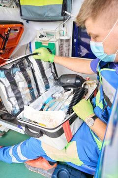 Paramedic holds in his hands a set for first aid