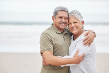 Senior couple, portrait and hug at beach for holiday, vacation or tropical travel in retirement...