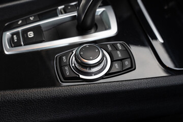 Stylish interior desgn of luxury car with automatic gearbox and control buttons for air...