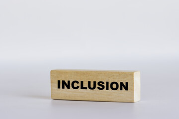 Inclusion symbol. Wooden blocks with word Inclusion on white background. Business, Inclusion...