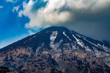 a view of the summit of mount nantai in nikko in early spring