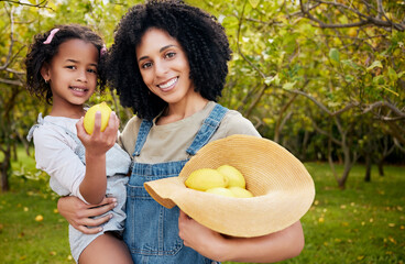 Woman with child, lemon orchard and nature, agriculture with healthy food and nutrition, portrait on citrus farm outdoor. Farmer, mother and daughter time picking fruit and smile, harvest and bonding