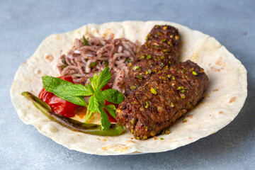 Traditional delicious Turkish cuisine, kebab type belonging to Adana and Antep regions, grilled...