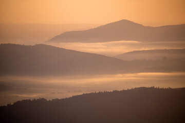 Mist-Covered Mountain Range at Sunrise