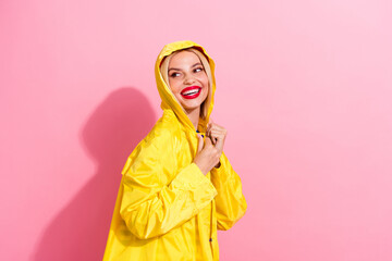 Profile photo of nice girl hide against rainstorm hiding hood waterproof jackets looking brand banner isolated on pink color background