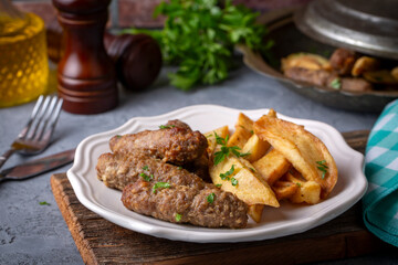 Traditional Turkish food; dry meatballs or inegöl meatballs with potatoes (Turkish name; Kuru kofte or anne koftesi)
