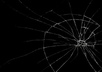 Broken glass as spider web or as bullet hole in the door photography, black and white isolated background