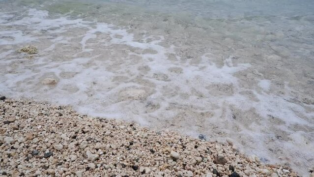 Beach side waves. white sand beach and waves.